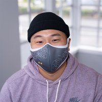 A tri-layer mask built with a center seam for breathability, nose... from ASI...