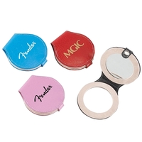 Shaped like a compact, its sleek leather exterior is trimmed with... from ASI...