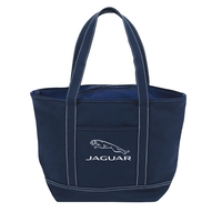Solid colored canvas boat tote with shoulder length handles, front pocket......