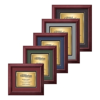 The mahogany finished wood frame of the Darlington award is complimented......