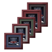 The mahogany finished wood frame of the Darlington award is complimented......