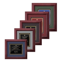 The mahogany finished wood frame of the Darlington award is complimented......