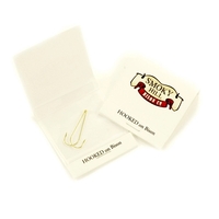 Two Gold-plated fishing hooks in matchbook