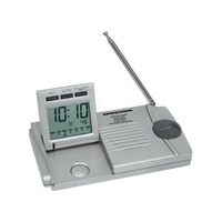 Slim traveler AM/FM radio/alarm clock/flashlight