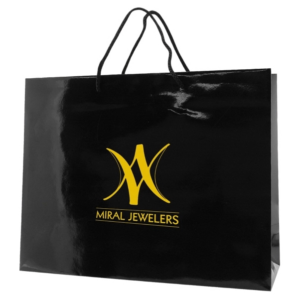 Made from 180 GSM gloss laminated paper, these shopping totes feature... from ASI 75731 PWS / Pacific Western Sales/Cater Line