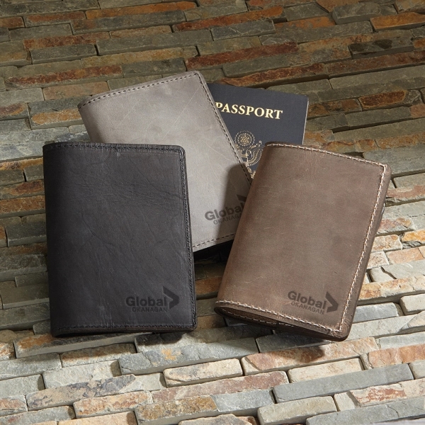 4 1/8" x 5 1/2" x 1/4" leather passport holder; made... from ASI 88060 Snugz/USA Inc / SnugZ USA®