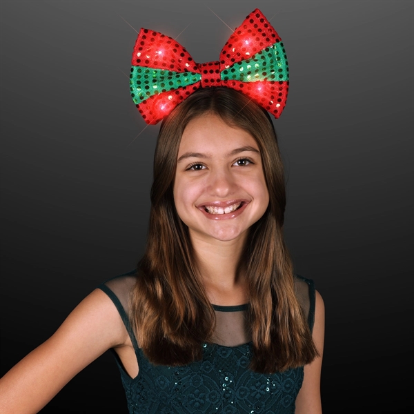 Light Up Festive Christmas Bow Headbands Are Large, Festive and Have... from ASI 34194 ALightPromos / Alight Promotional Products