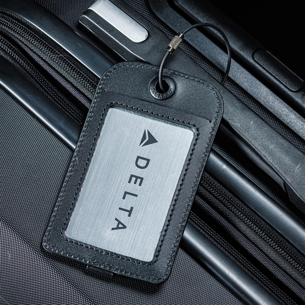 Luggage tag made of black leather with a plate insert that... from ASI 48125 Dacasso / DaCasso