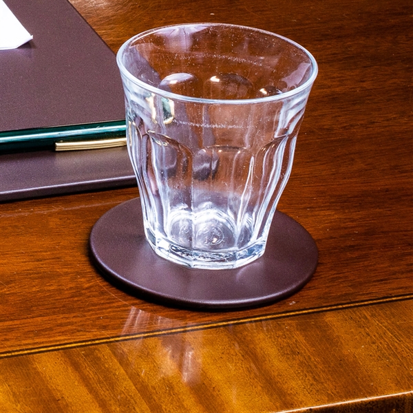 Chocolate brown coaster made of leatherette with a protective felt bottom.... from ASI 48125 Dacasso / DaCasso