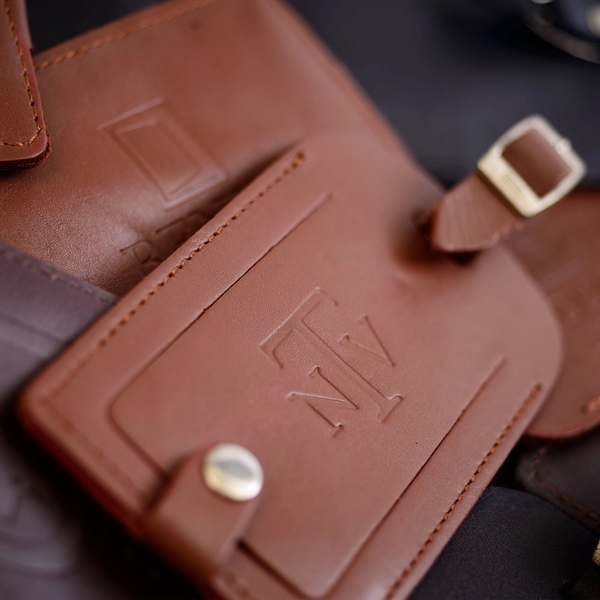 Classic brown luggage tag made of rustic leather with an identification... from ASI 48125 Dacasso / DaCasso