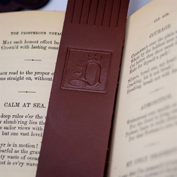 Custom classic bookmark made of chocolate brown leather with a tasseled... from ASI 48125 Dacasso / DaCasso