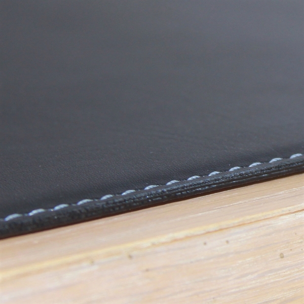 Black rectangular placemat made of leatherette material with an accent-stitched edge.... from ASI 48125 Dacasso