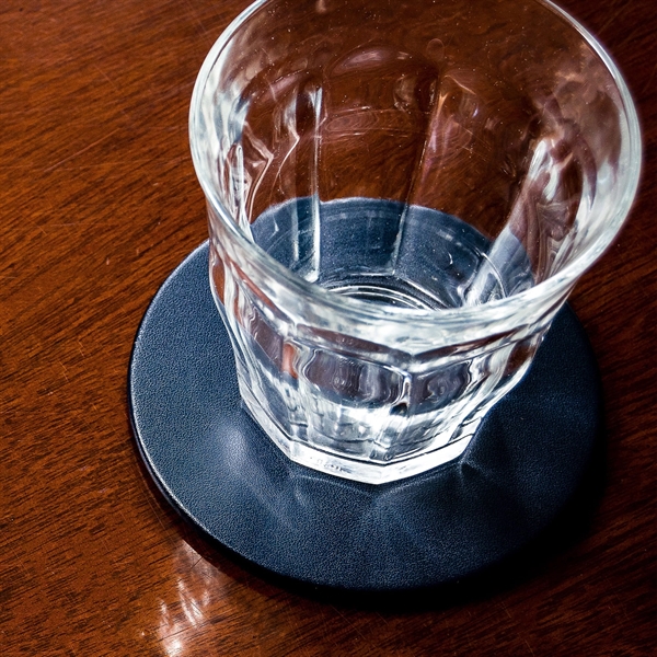 Set of four round coasters made of navy blue leatherette with... from ASI 48125 Dacasso / DaCasso