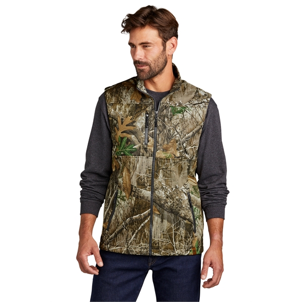 Russell Outdoors Realtree Atlas Soft Shell Vest... from ASI 84863 SanMar