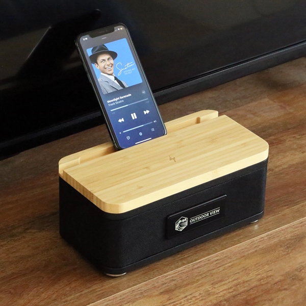 Sleek wireless bamboo speaker and charger... from ASI 61966 HPG / OrigAudio