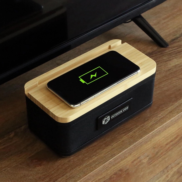 Sleek wireless bamboo speaker and charger... from ASI 61966 HPG / OrigAudio