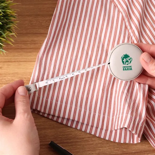 A vegan leather 5" tape measure featuring a dual-sided 60" tape... from ASI 61966 HPG / Beacon Promotions