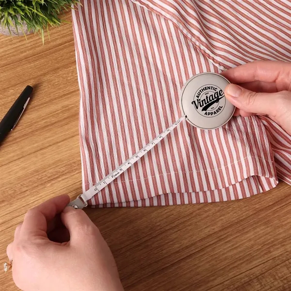 A vegan leather 5" tape measure featuring a dual-sided 60" tape... from ASI 61966 HPG / Beacon Promotions