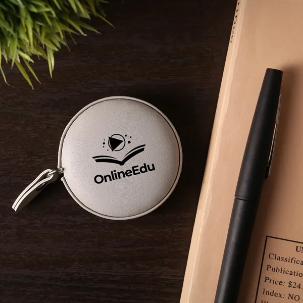 A vegan leather 5" tape measure featuring a dual-sided 60" tape... from ASI 61966 HPG / Beacon Promotions