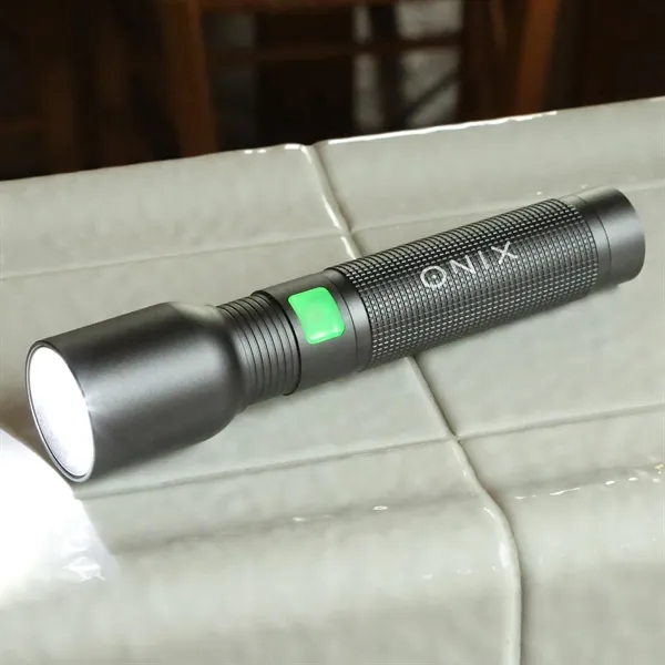 A rechargeable flashlight with case, offers a secure grip, powerful illumination,... from ASI 61966 HPG / Beacon Promotions