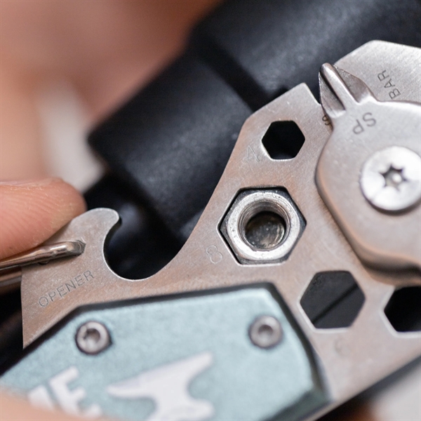 3.3" x 1.5" stainless steel 14-in-1 pocket tool with carabiner clip... from ASI 52263 EMT