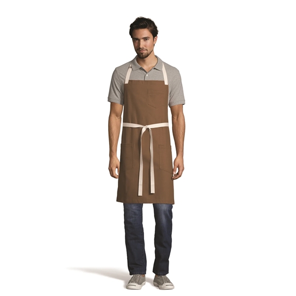 Bib apron available in patterns and contracting colors, featuring two reinforced... from ASI 36558 Aprons, Etc.