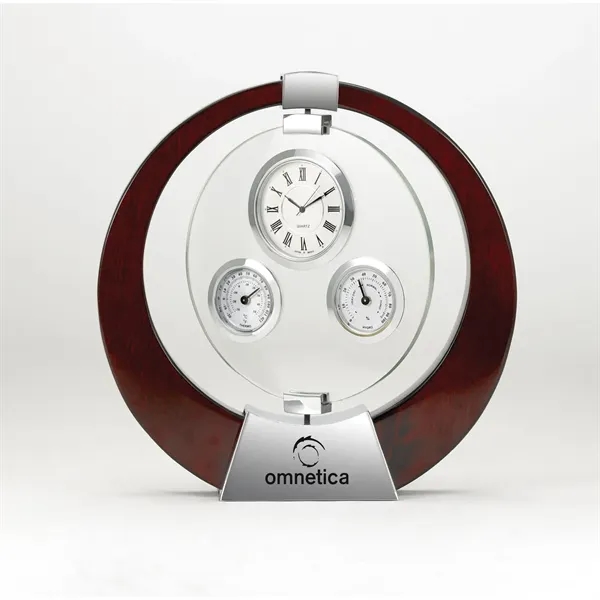 Desk clock designed with gimbaled movement and features a thermometer and... from ASI 68507 The Magnet Group / Benchmark Crystal & Clocks