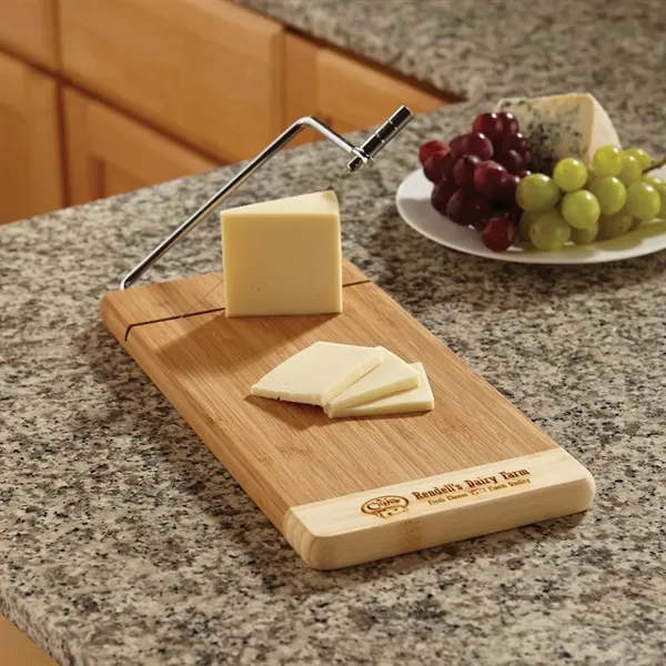 Two-tone environmentally friendly bamboo cheese cutter.... from ASI 68507 The Magnet Group / Benchmark Crystal & Clocks