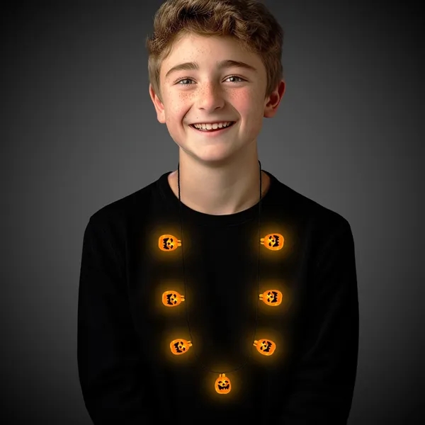 34" Jack-O-Lantern Halloween necklaces with seven light up LED charms.... from ASI 42016 Brighter Promotions Inc