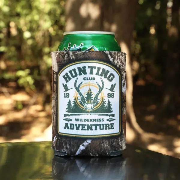A beverage insulator featuring a licensed REALTREE® imprint and high-density foam... from ASI 61966 HPG / Best Promotions USA