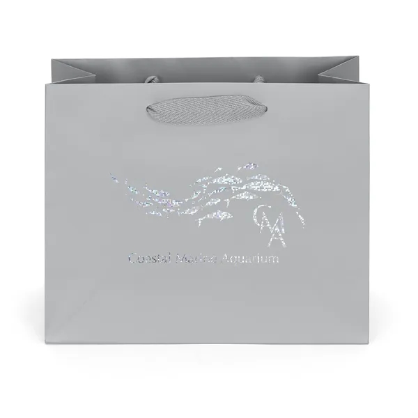 Premium-weight matte-laminated bag with woven handles and fold-over top.... from ASI 37940 Bag Makers Inc