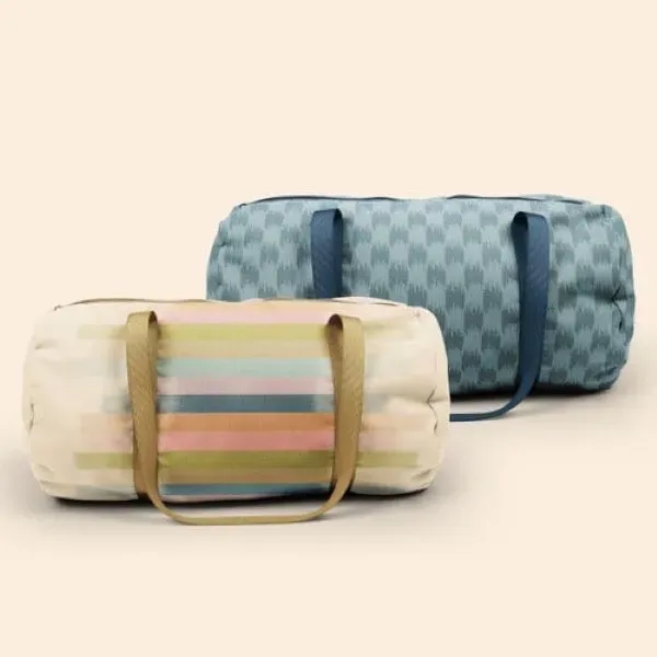 A canvas, barrel body Darling Duffel. It has a huge imprint... from ASI 74710 Numo