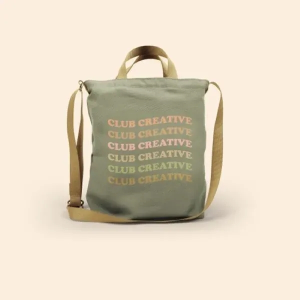 A large canvas crossbody tote with a long handle, also two... from ASI 74710 Numo