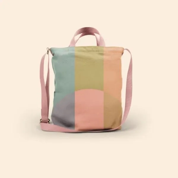 A large canvas crossbody tote with a long handle, also two... from ASI 74710 Numo