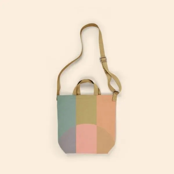 A large canvas crossbody tote with a long handle, also two... from ASI 74710 Numo
