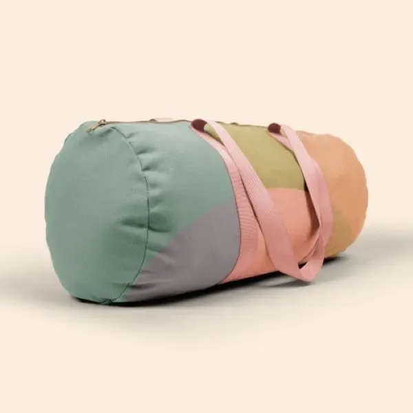 A canvas, barrel body Darling Duffel. It has a huge imprint... from ASI 74710 Numo