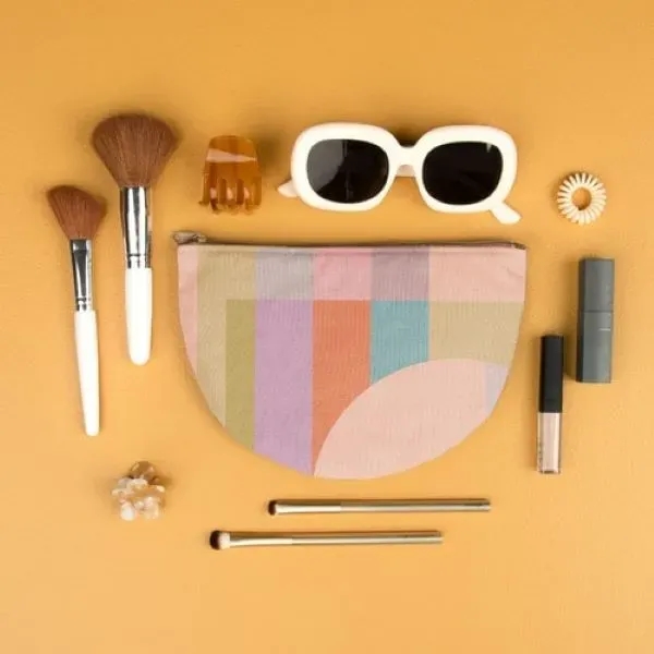 The Slice is a flat, half-moon shaped canvas pouch with a... from ASI 74710 Numo