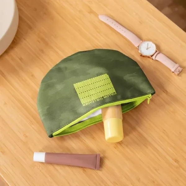 The Slice Pouch is a flat, half-moon shaped canvas pouch with... from ASI 74710 Numo