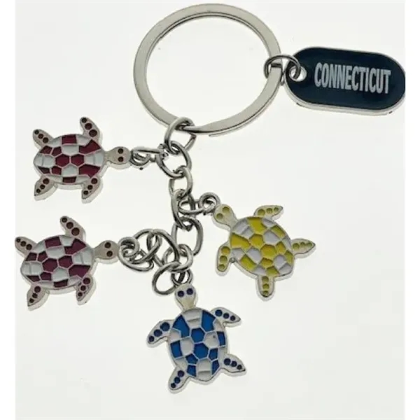 Dangling key tag with foot or turtle charms.... from ASI 40610 Perry Blackburne Inc