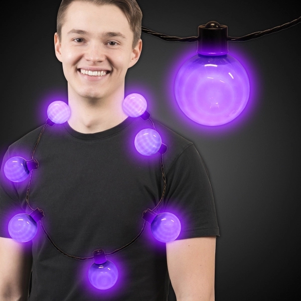 Necklace with 7 plastic white balls, 6 light settings and a... from ASI 42016 Brighter Promotions Inc