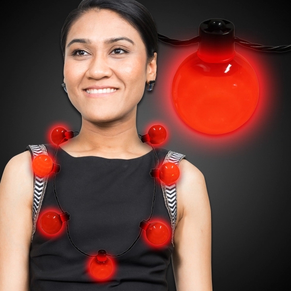 Necklace with 7 plastic white balls, 6 light settings and a... from ASI 42016 Brighter Promotions Inc