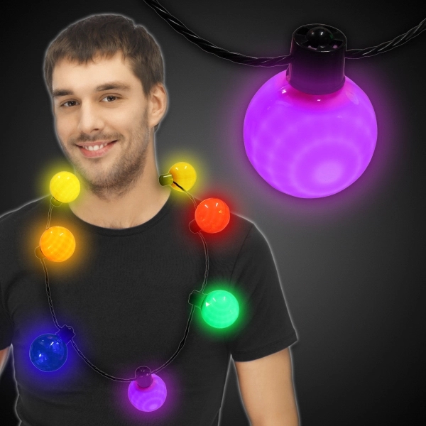 Necklace with 7 plastic white balls, 6 light settings and a... from ASI 42016 Brighter Promotions Inc