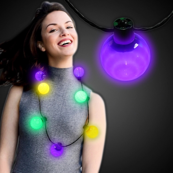 Necklace with 7 plastic white balls, 6 light settings and a... from ASI 42016 Brighter Promotions Inc
