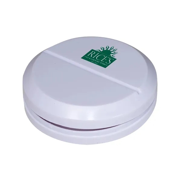 Plastic container with round tablet-shaped design with small metal slicer that... from ASI 34063 alphabroder