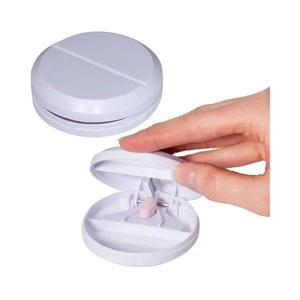 Plastic container with round tablet-shaped design with small metal slicer that... from ASI 34063 alphabroder
