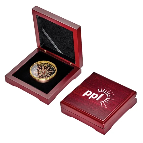 Multi-color desk compass measuring 2" in diameter and sitting inside of... from ASI 46170 Compass Industries Inc