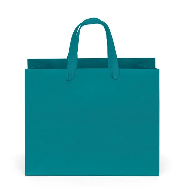 Premium-weight matte-laminated bag with woven handles and fold-over top.... from ASI 37940 Bag Makers Inc