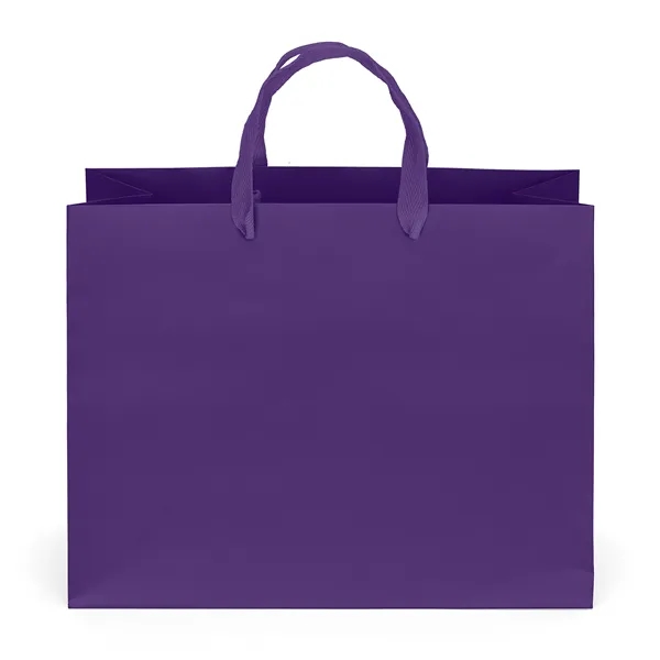 Premium-weight matte-laminated bag with woven handles and fold-over top.... from ASI 37940 Bag Makers Inc