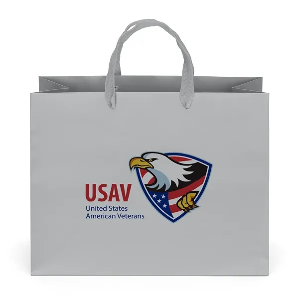 Premium-weight matte-laminated bag with woven handles and fold-over top.... from ASI 37940 Bag Makers Inc