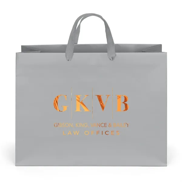 Premium-weight matte-laminated bag with woven handles and fold-over top.... from ASI 37940 Bag Makers Inc